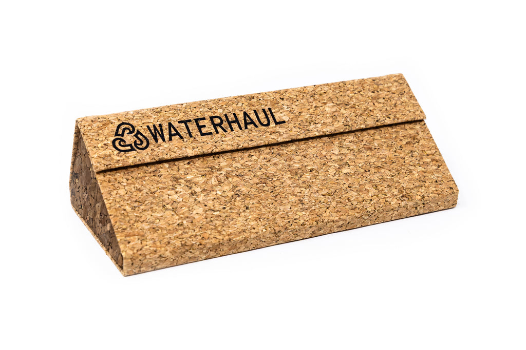 Triangular cork glasses case with 'WATERHAUL' branding on a white background