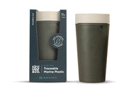 Green reusable cup with beige lid and packaging on a white background