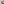         Person holding a textured green coffee cup with a blurred background